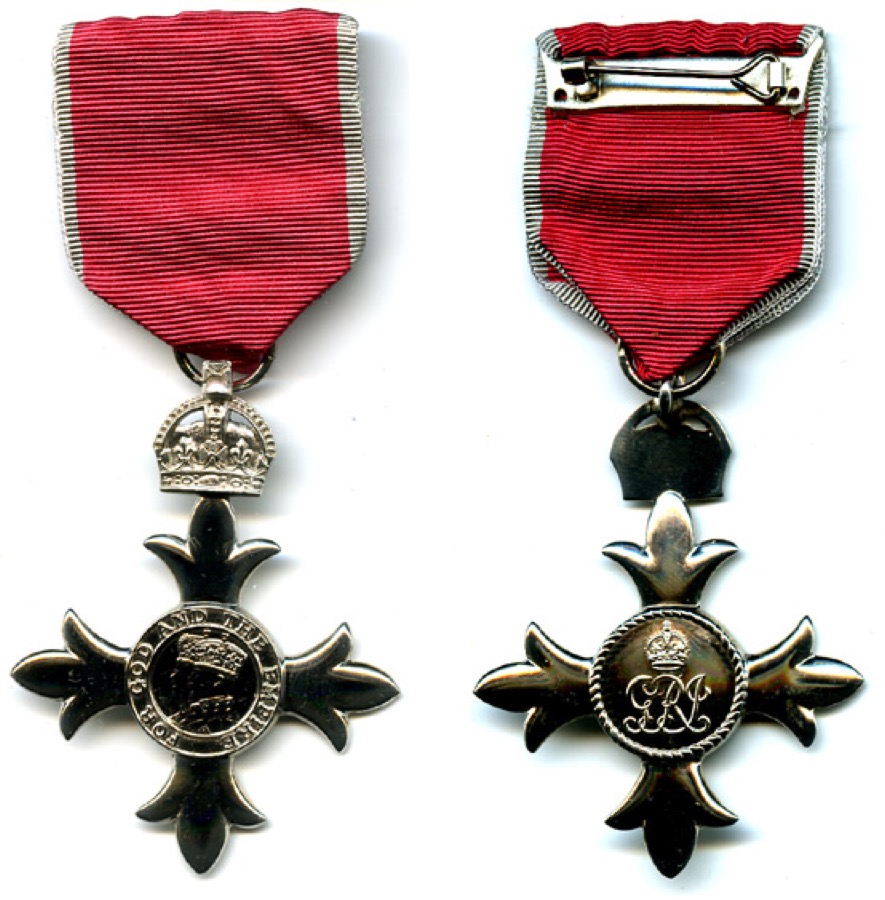 M.B.E.